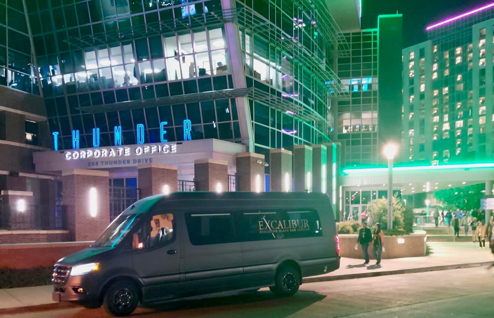 Excalibur-branded matte black Mercedes-Benz Sprinter in daylight, Oklahoma City